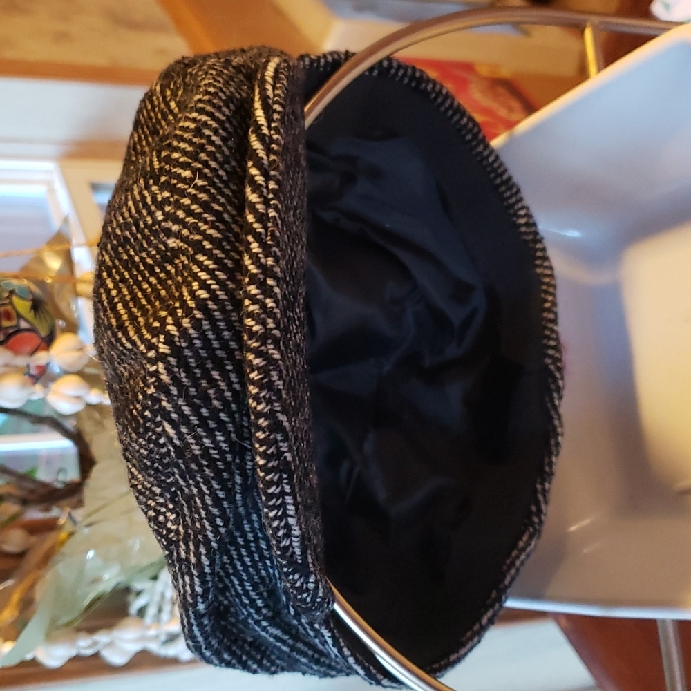 Like new made in Italy tweed cap.  Very cool, excellent quality